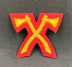 Mess Dreas Axes Gold Bullion On Red Cloth